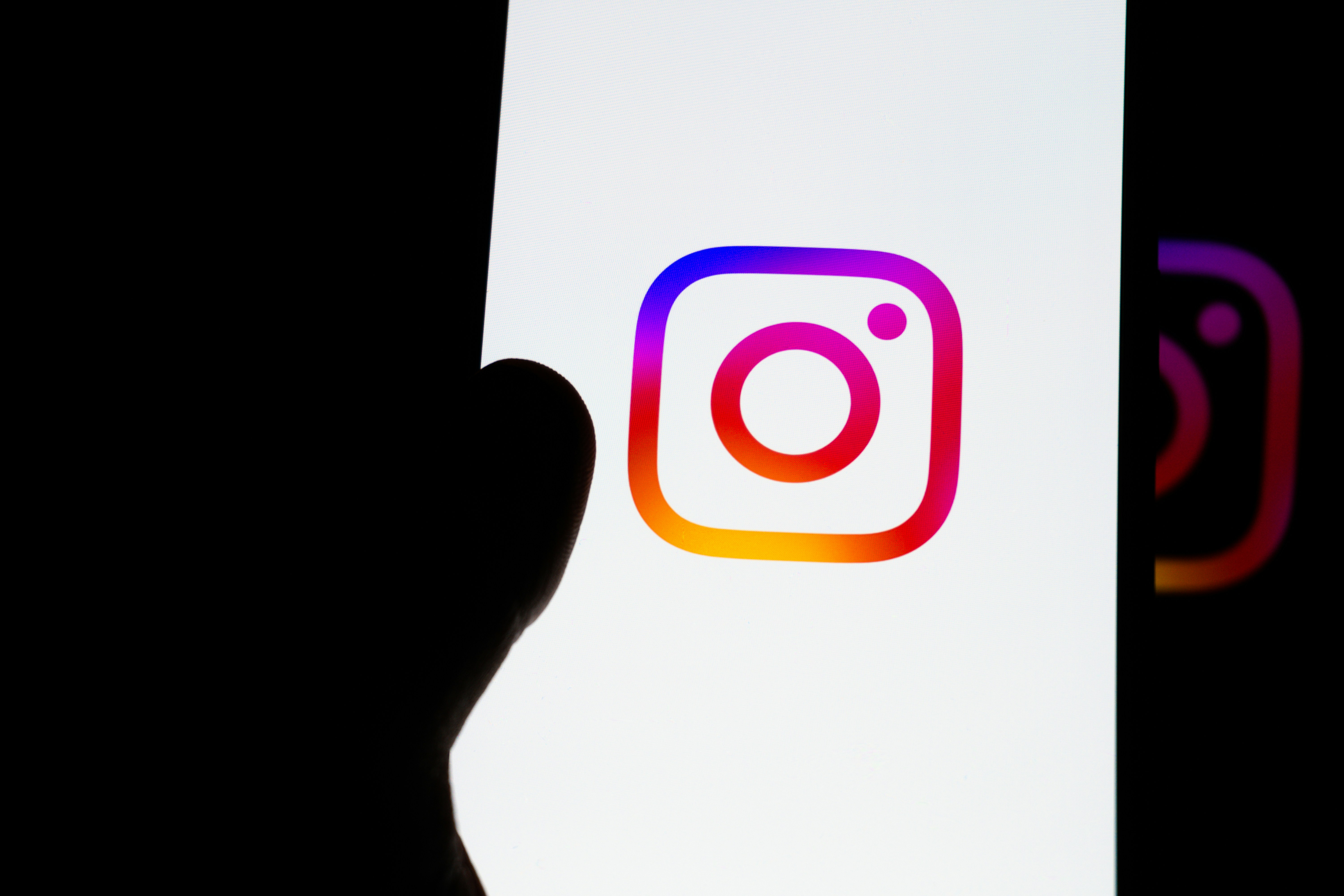 Instagram logo displayed on a smartphone screen.
